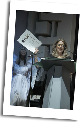 US Director Delara Rasouli demonstrates her 'Best Art Film Award' for 'Al Nessa' verses from the Holy Quran
